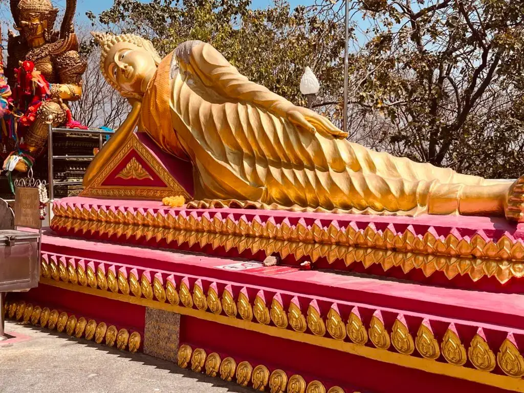 a reclining buddha at Big Buddha Hill