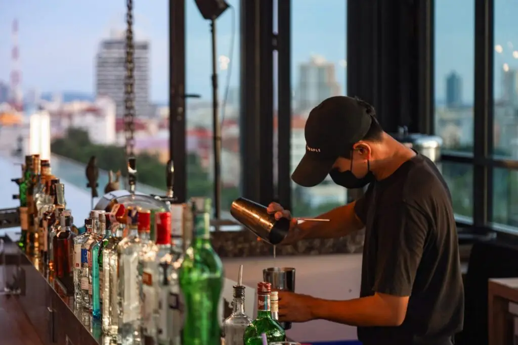 Bar tender mixing cocktails, a great night out in pattaya