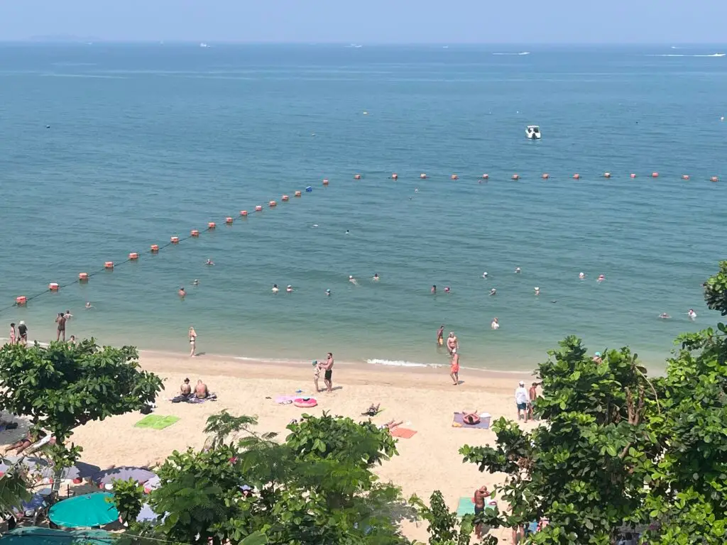 the view from the 3 mermaids in pattayaA stunning beachside view in Pattaya with clear blue skies and calm ocean waves