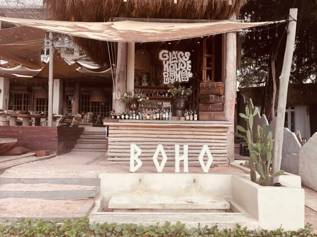 A scenic view of the beach from Cave Beach Club, showcasing the open-air design and tropical ambiance