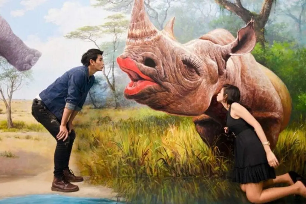 a man kissing a rhino at art in Paradise Pattaya, a top indoor activity on a rainy day