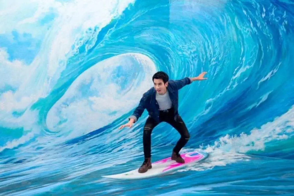 an illusion of a man surfing at art in paradise in pattaya, a great rainy day activity in pattaya